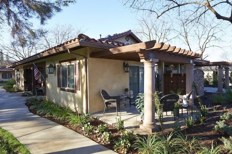Exterior of an apartment home with a patio at The Terraces of San Joaquin Gardens