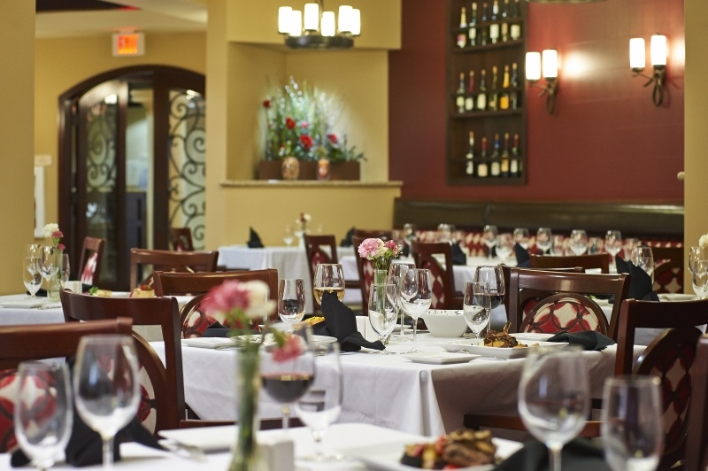 Dining tables at a restaurant at The Terraces at San Joaquin Gardens