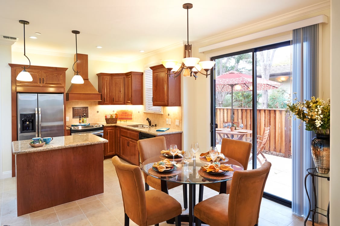 other angle of LR, DR, kitchen with patio umbrella 