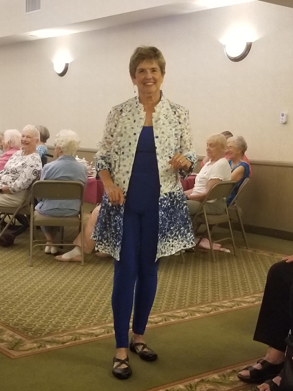 A resident in a white an blue shimmery jacket.