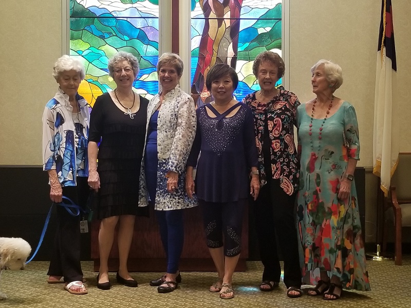 Royal Oaks residents in colorful dresses.