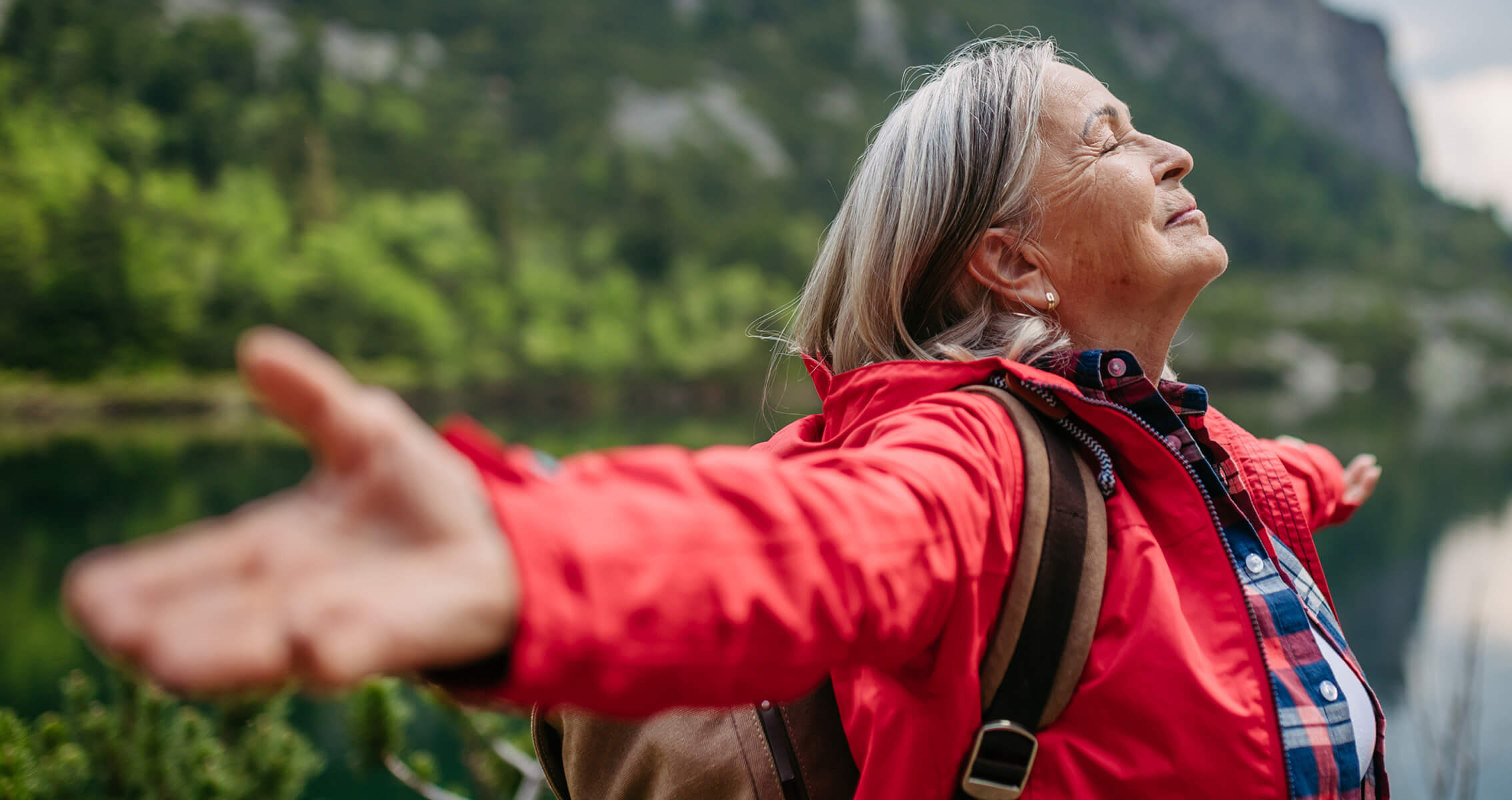 senior enjoying the outdoors while on a hike