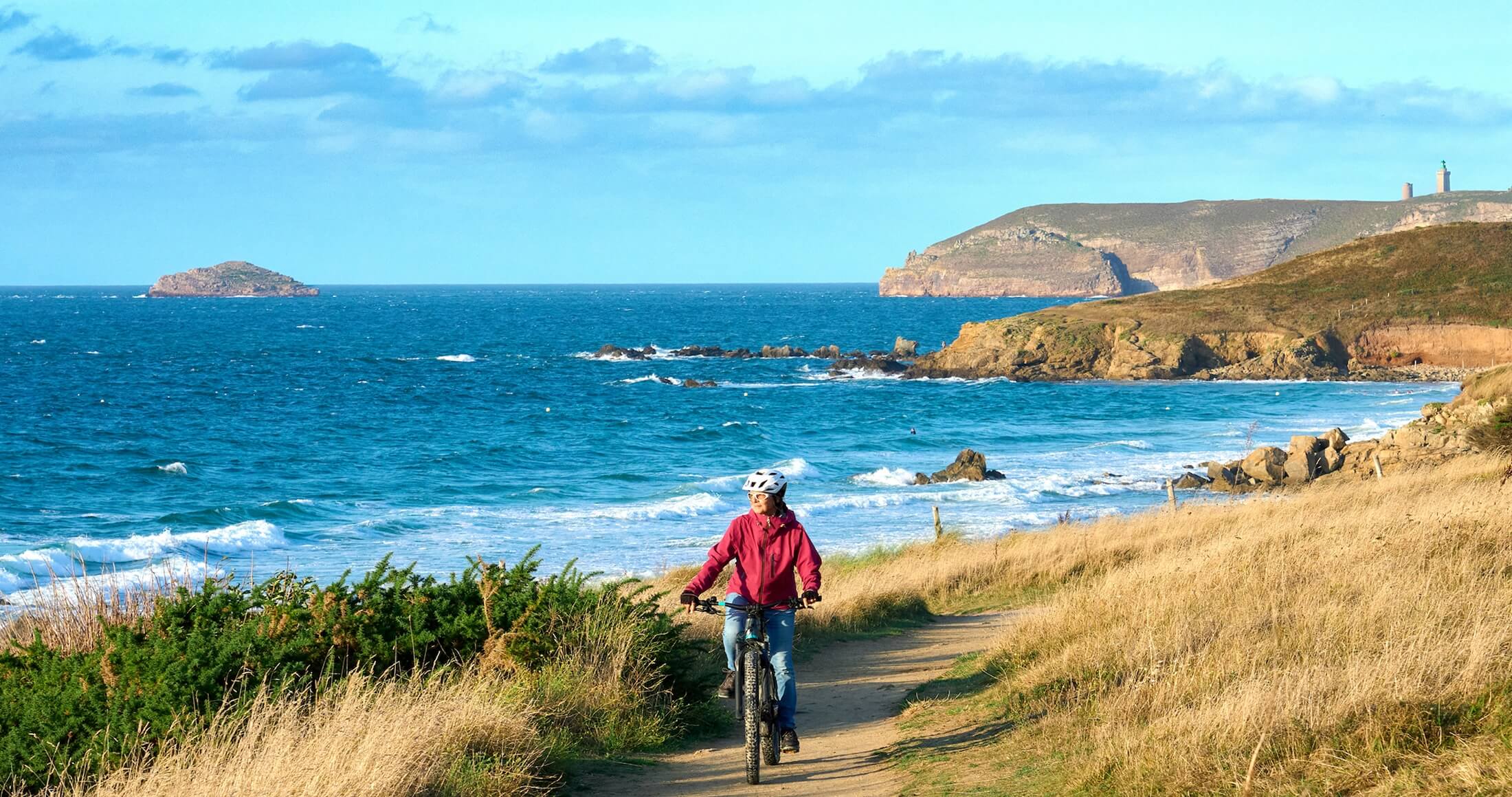 senior on a bike ride outside on trail