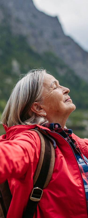 senior enjoying the outdoors while on a hike