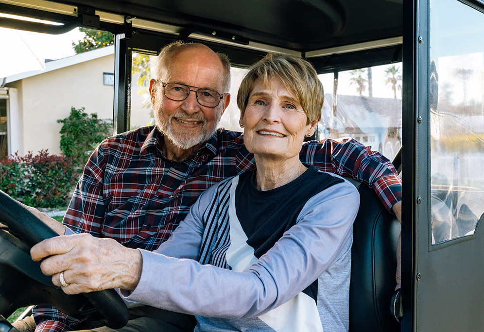 Don and Joanne in a golf cart