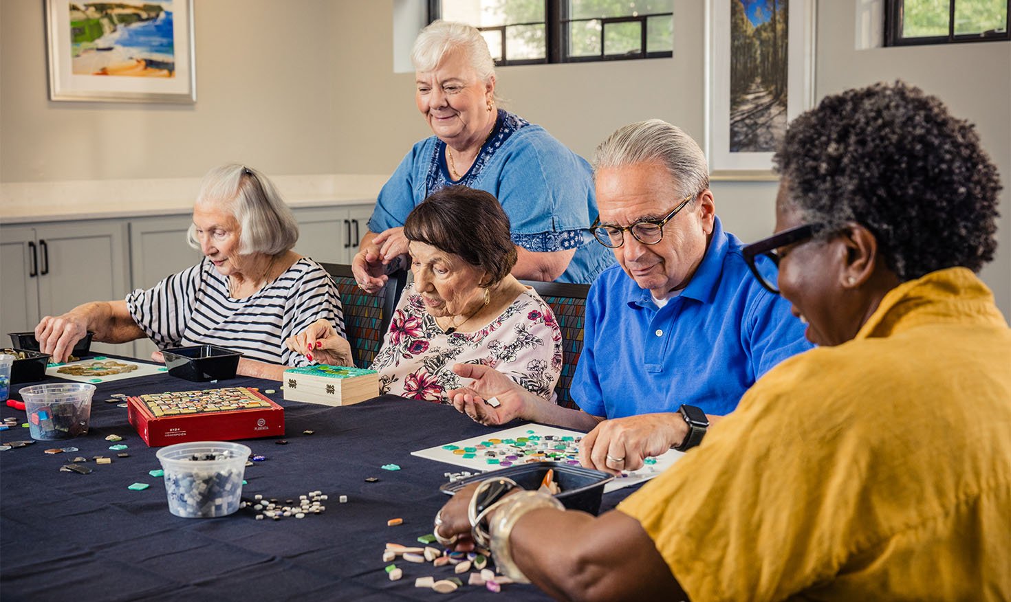 Group of senior friends doing puzzles together