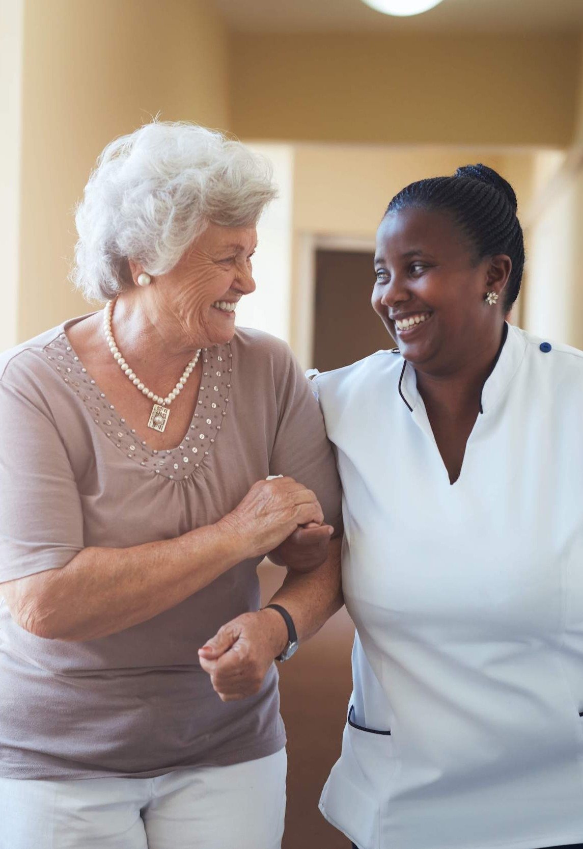 Nurse walking with woman