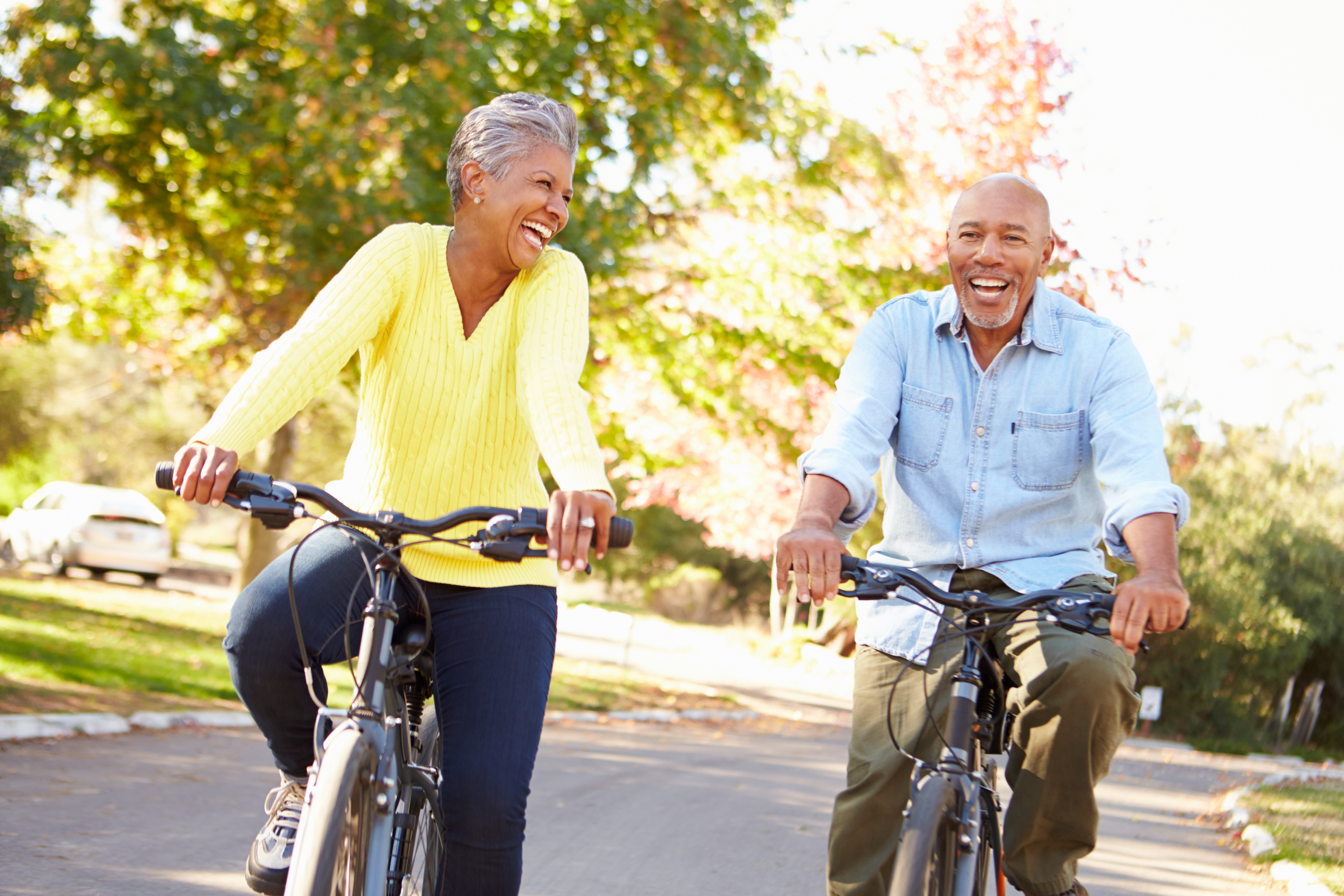 man and woman on bikes smiling at each other