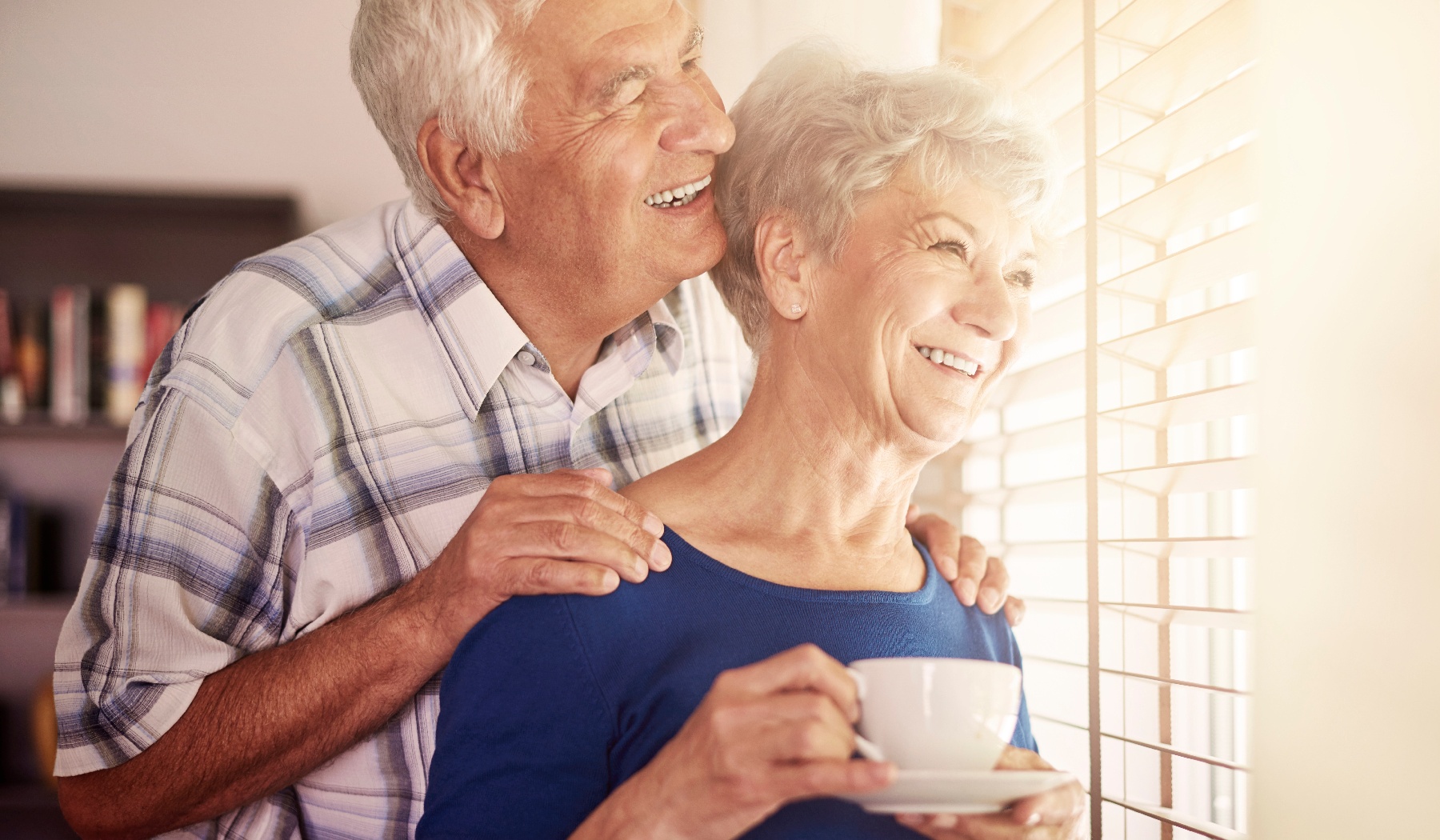 Senior couple next to the window