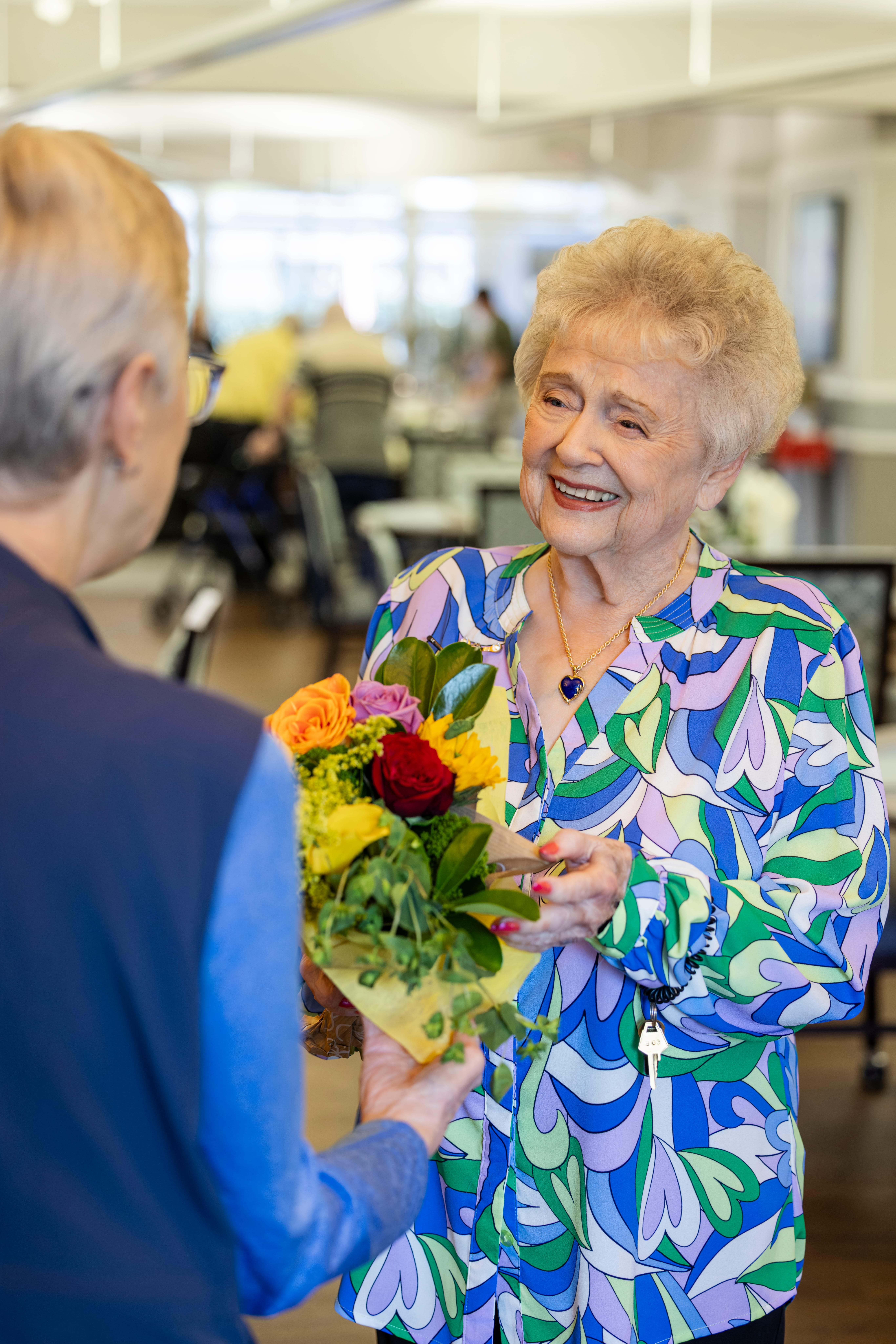 Nancy smiled as she received flowers.