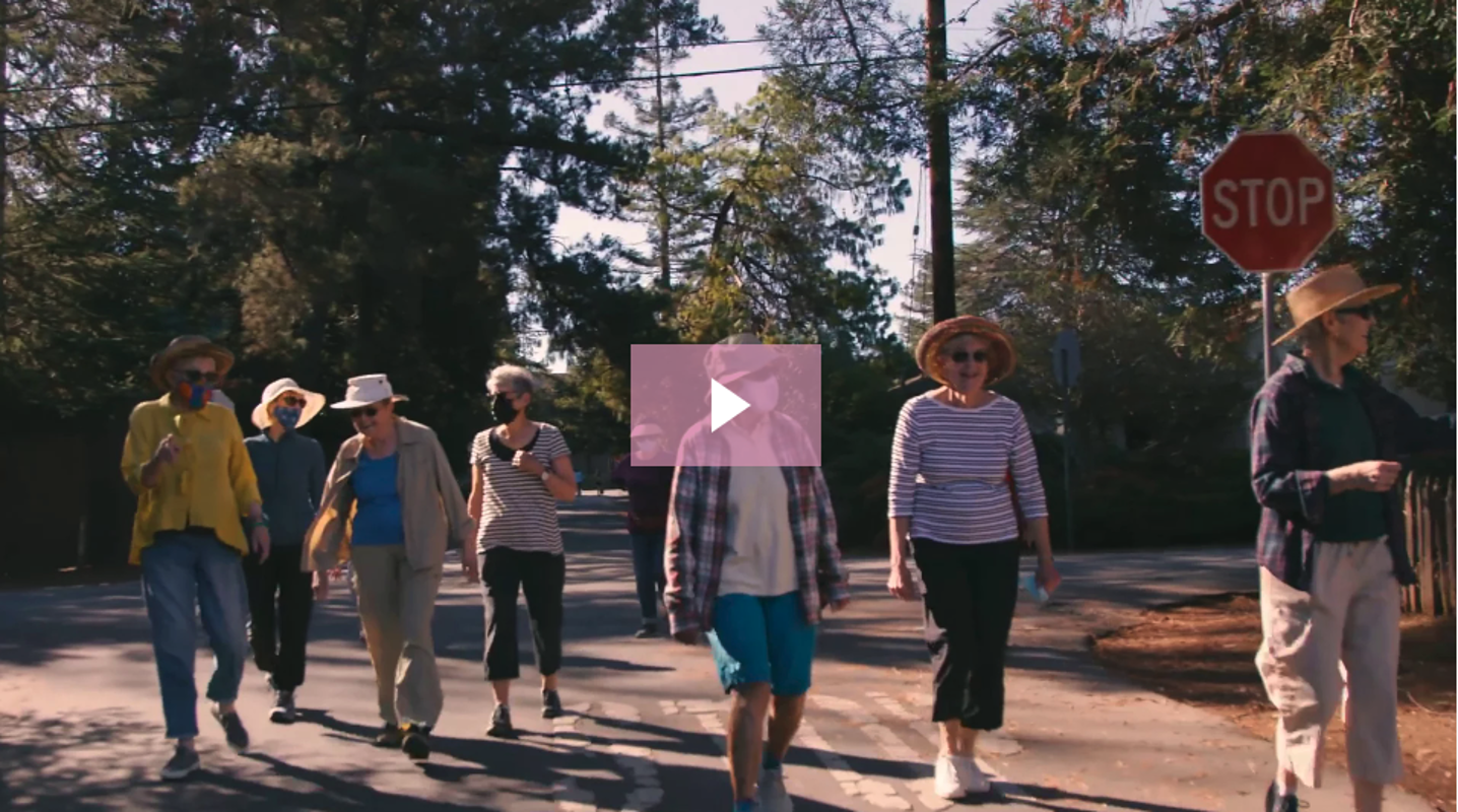 Group of active seniors walking outside