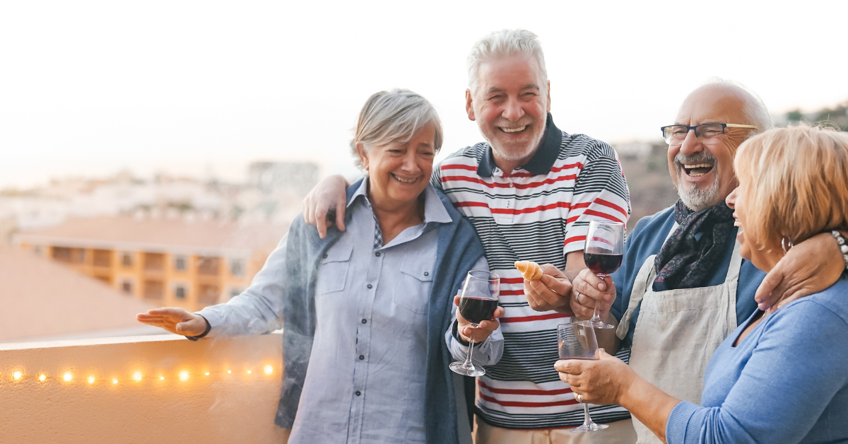 Friends laughing and enjoying a rooftop barbecue.