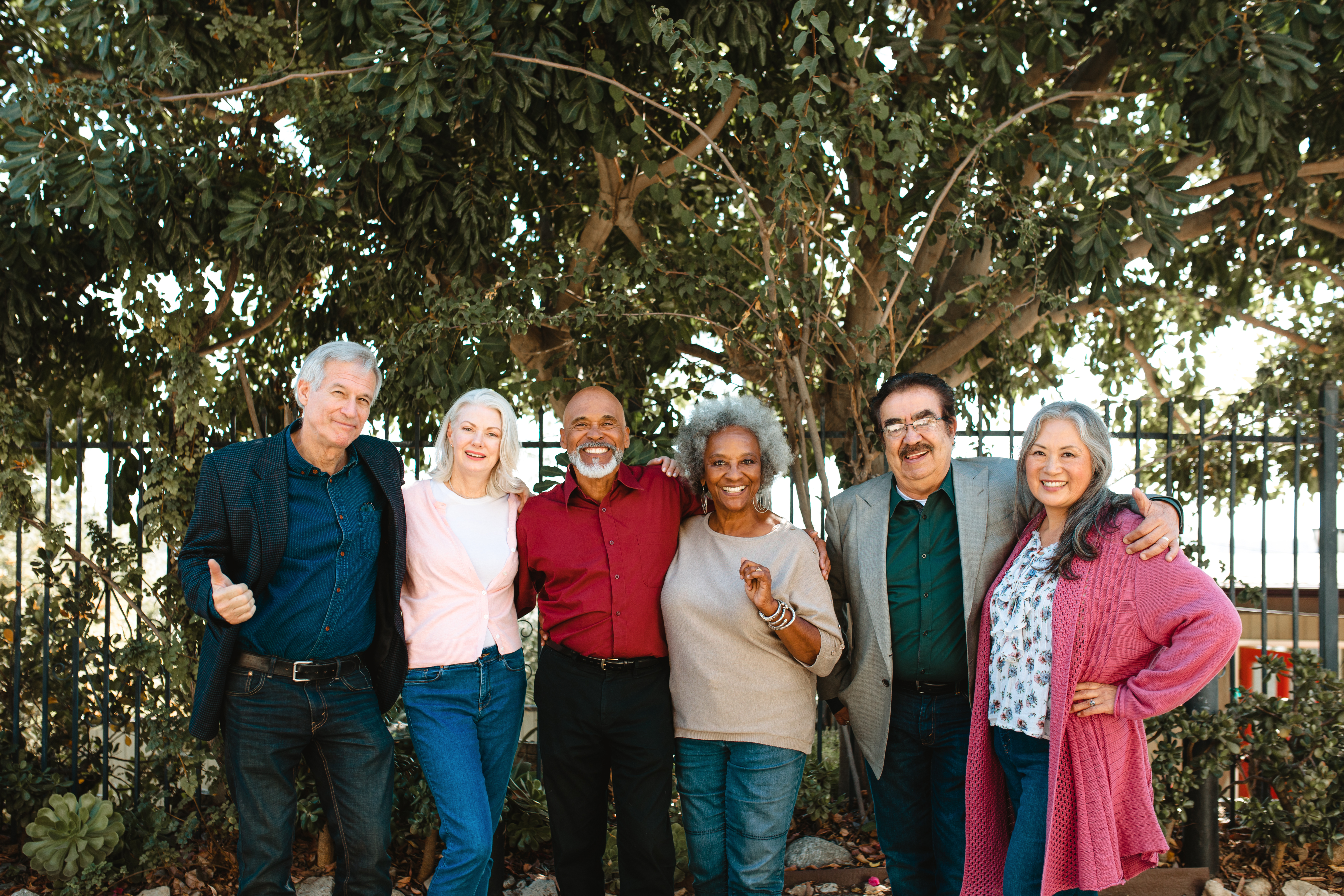 Group of older adults smiling outdoors