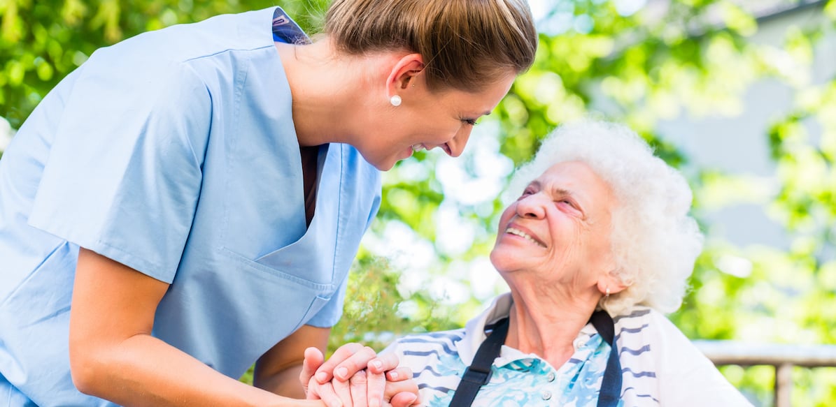 senior woman and nurse