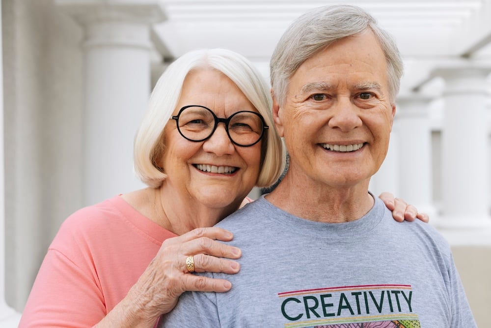 Peter and his wife smilling