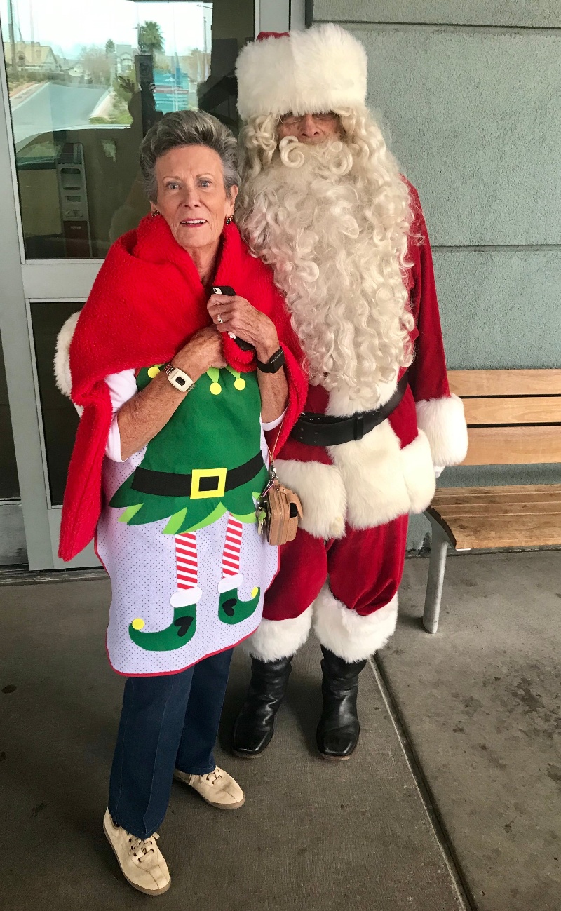 Residents dressed as an elf and Santa.