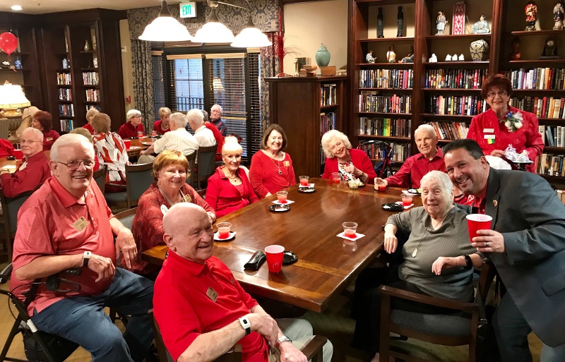 A group of seniors wearing red
