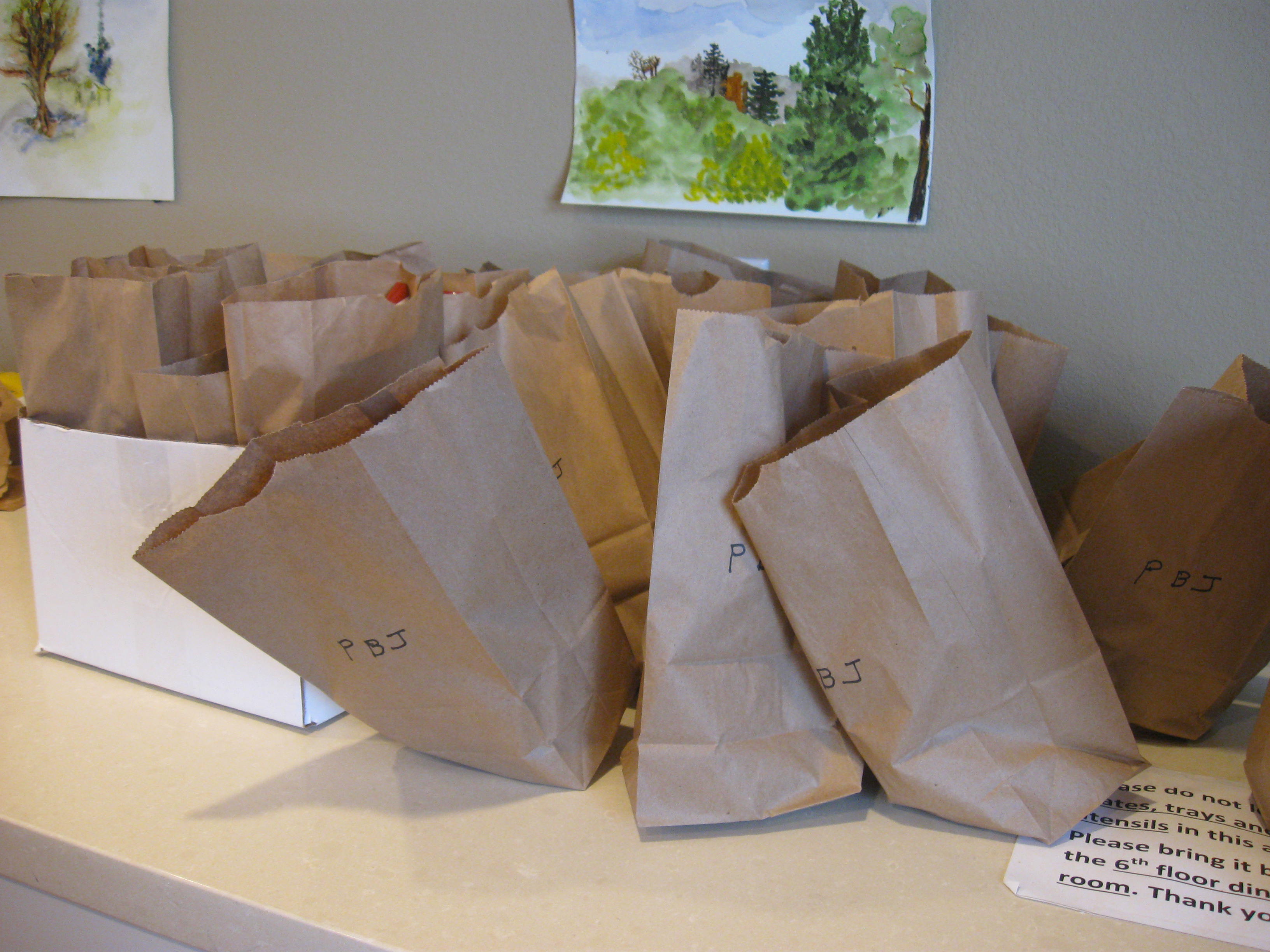 Residents pack lunches for the homeless