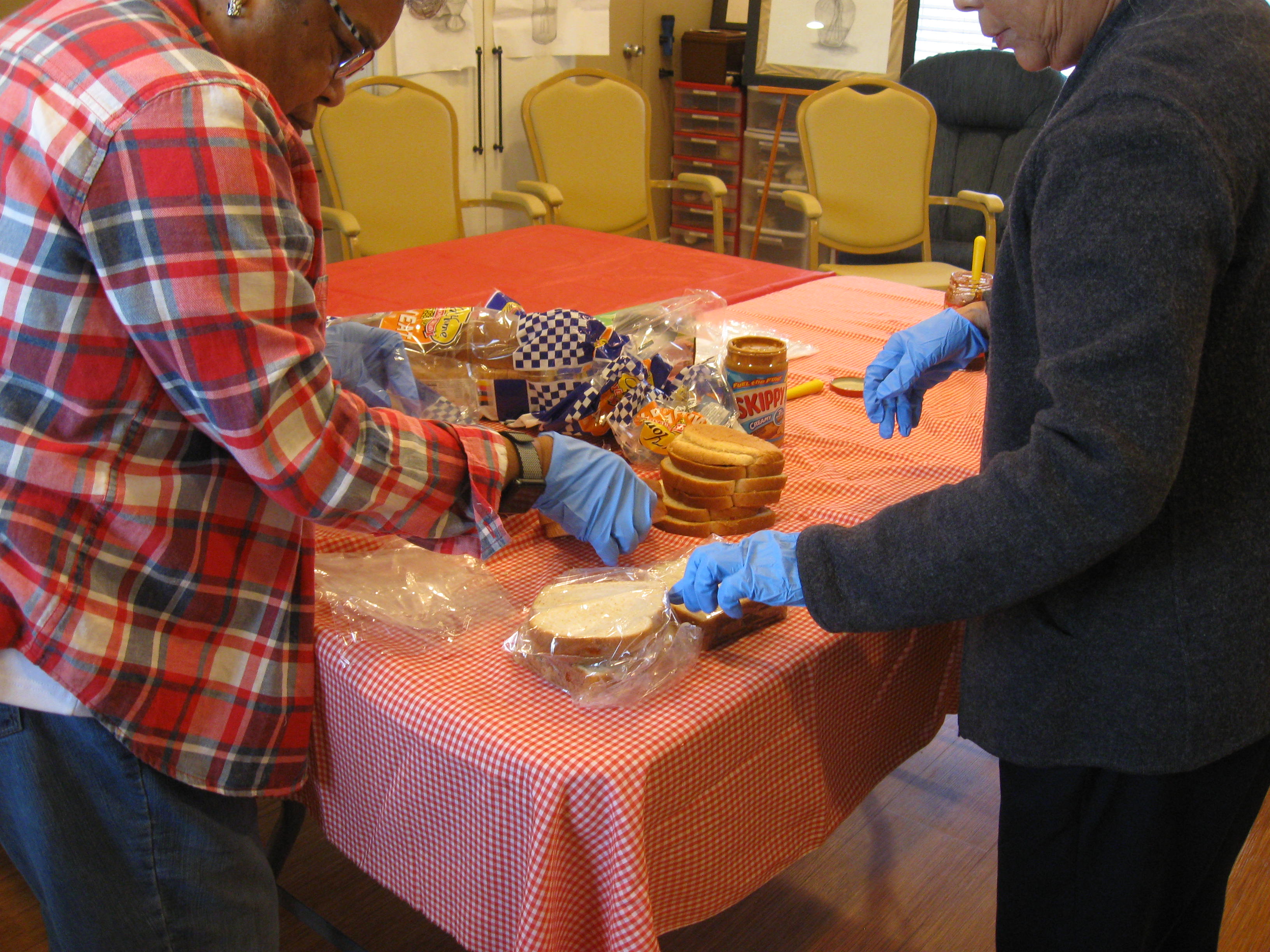 Residents pack lunches for the homeless