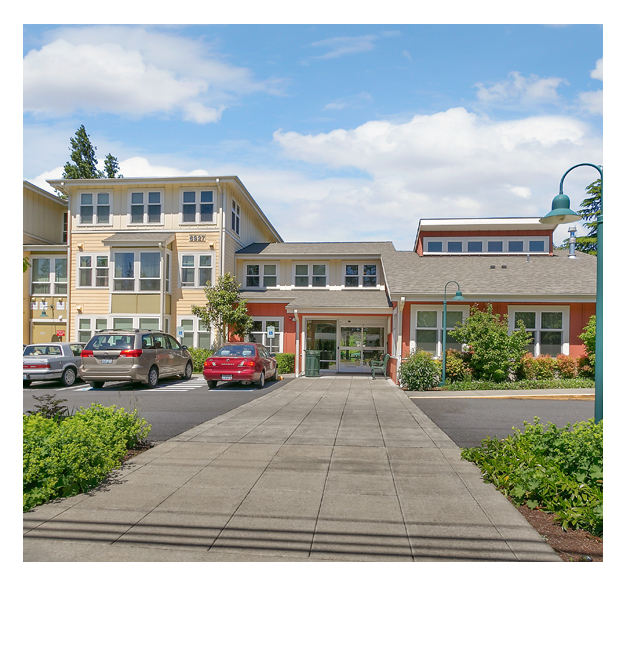 Colorful apartment buildings at the entrance to Shepherd's Garden affordable housing.