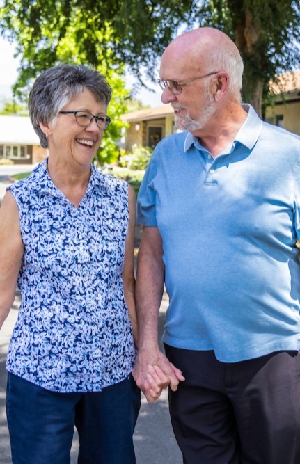 Couple holding hands and enjoying an outside walk