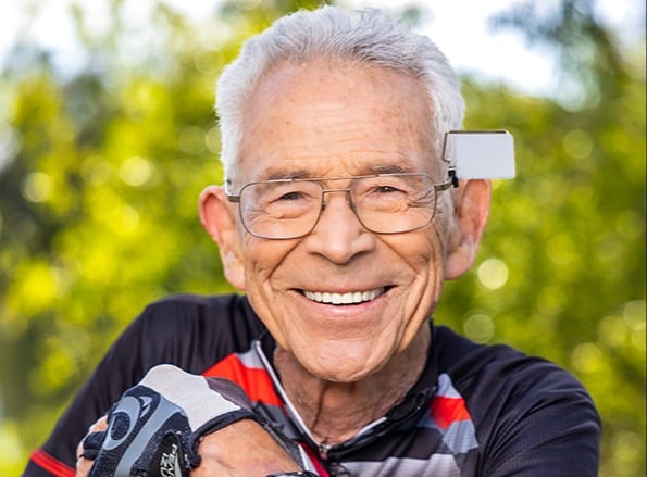 Close-up of smiling senior man in glasses