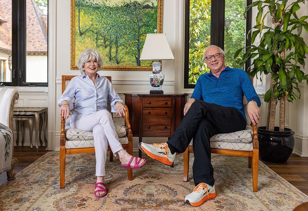 Terry and Debra sitting in living room chairs