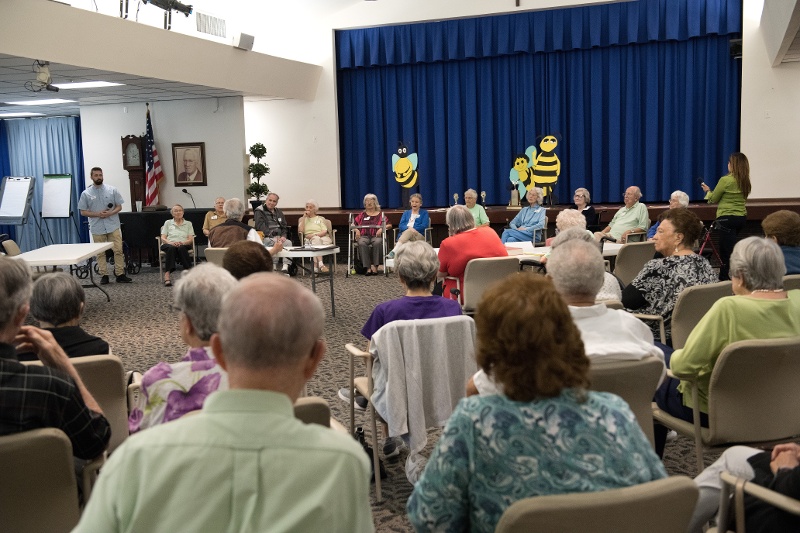 An audience watches the spelling bee.