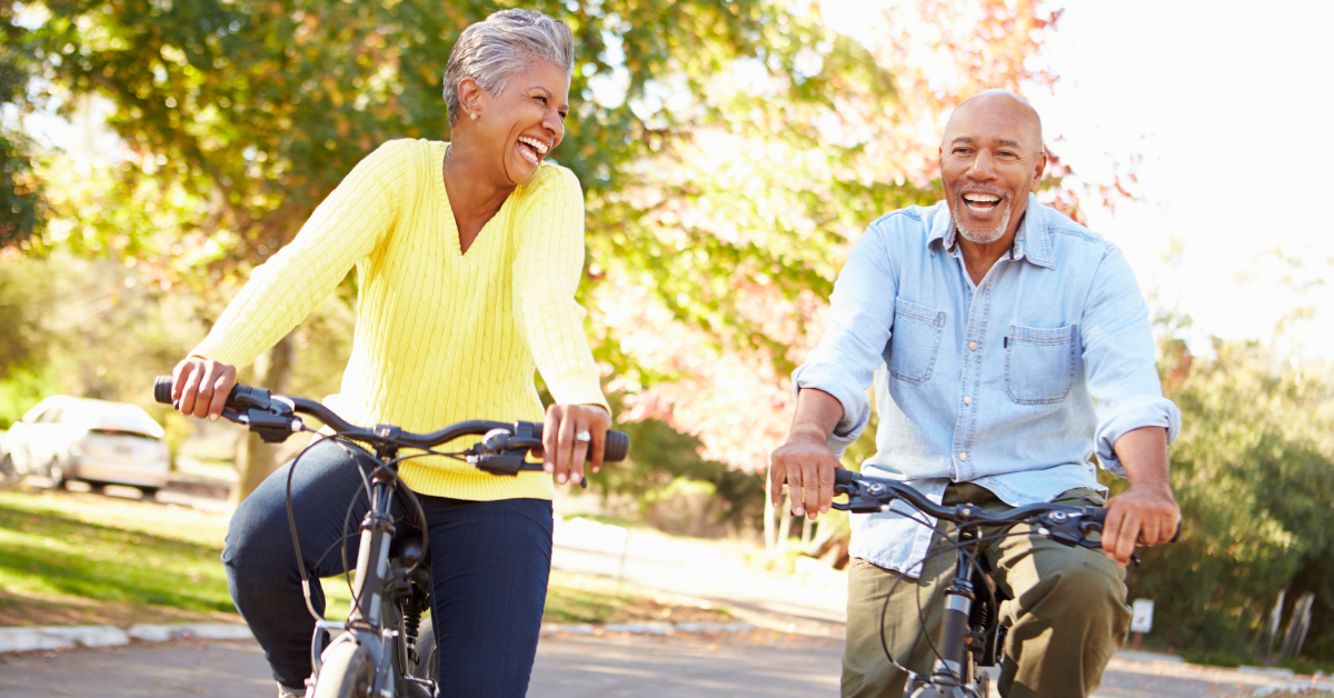 man and woman riding on bikes outside