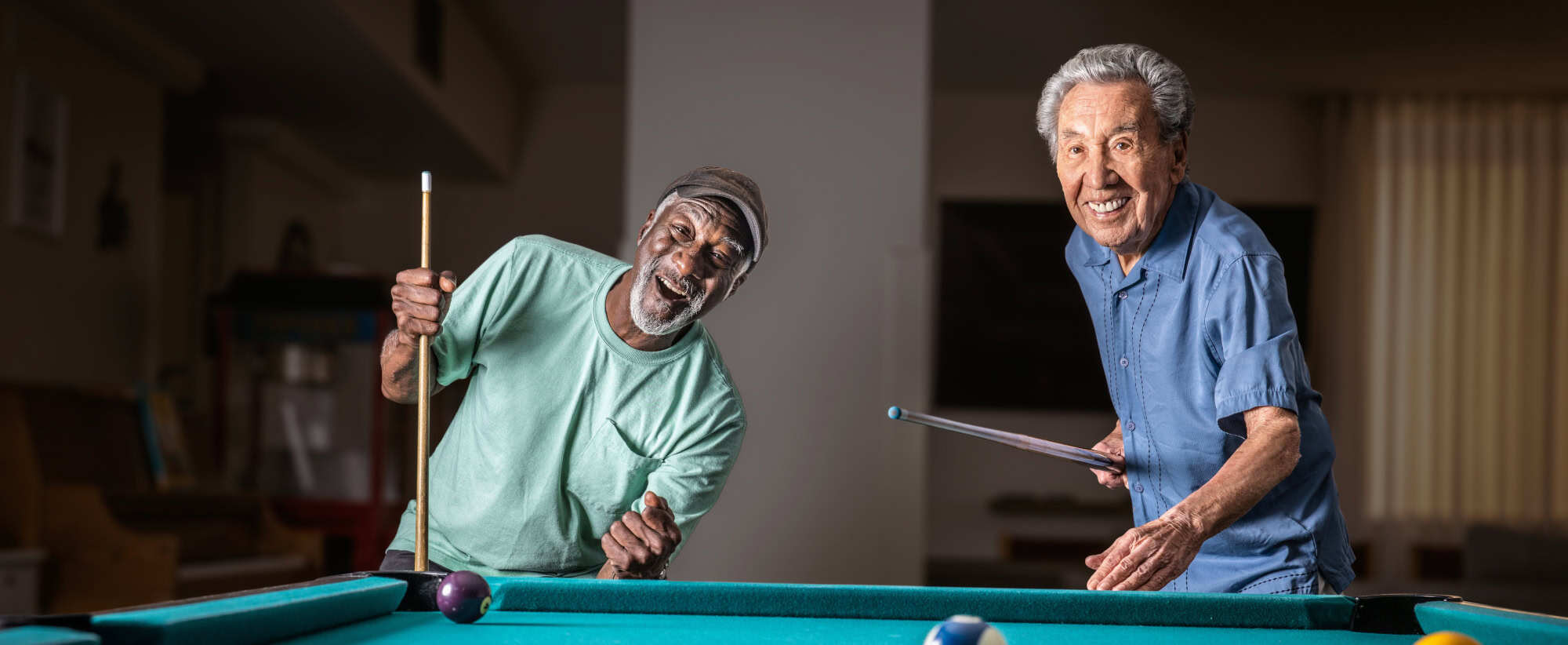 two men playing pool