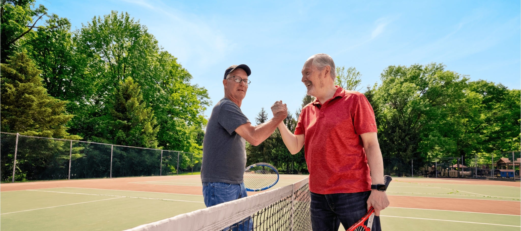 two men playing tennis together
