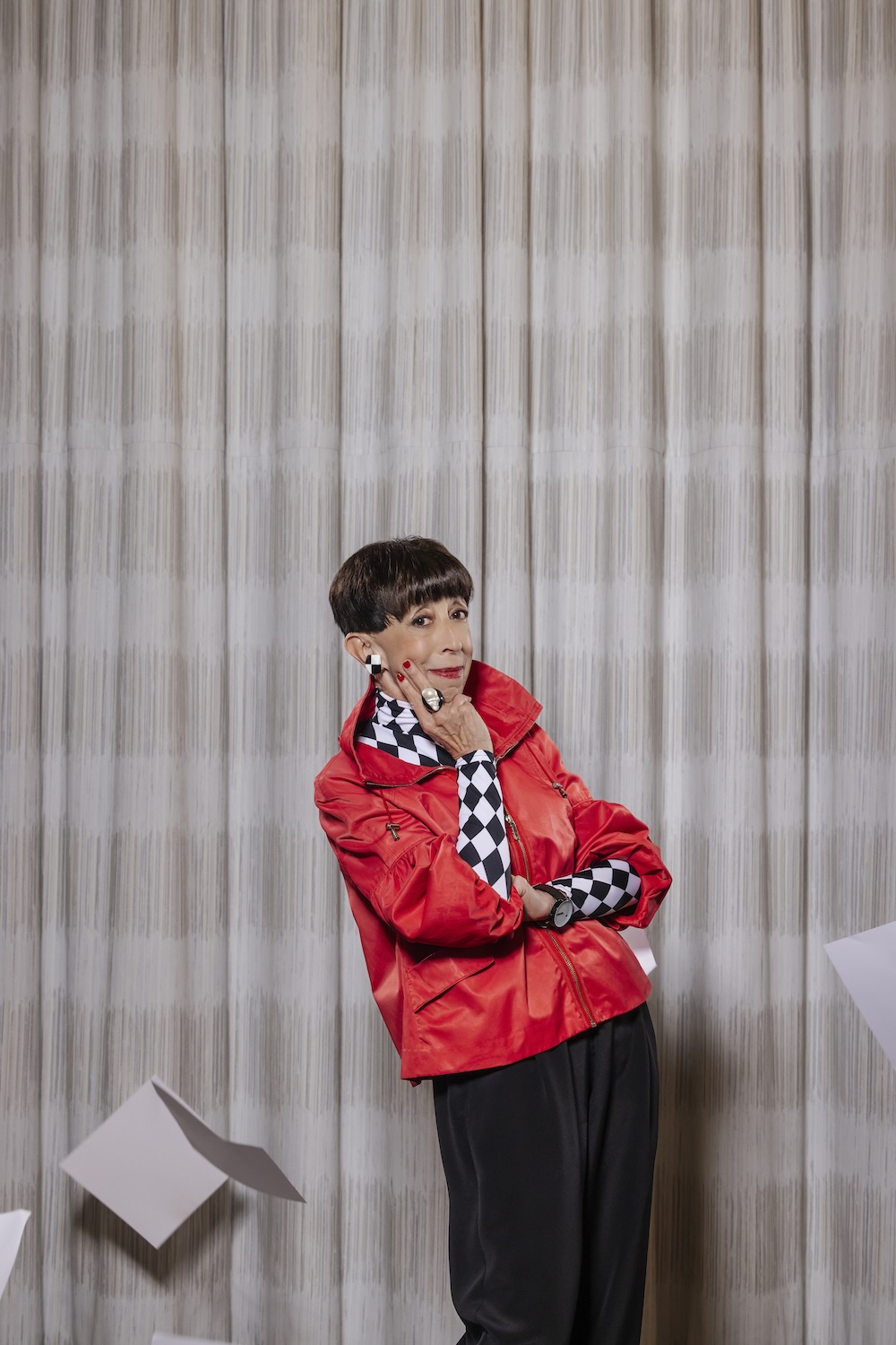 Suz posing in a stylish red jacket