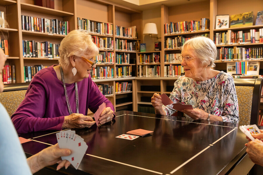 Two ladies playing cards