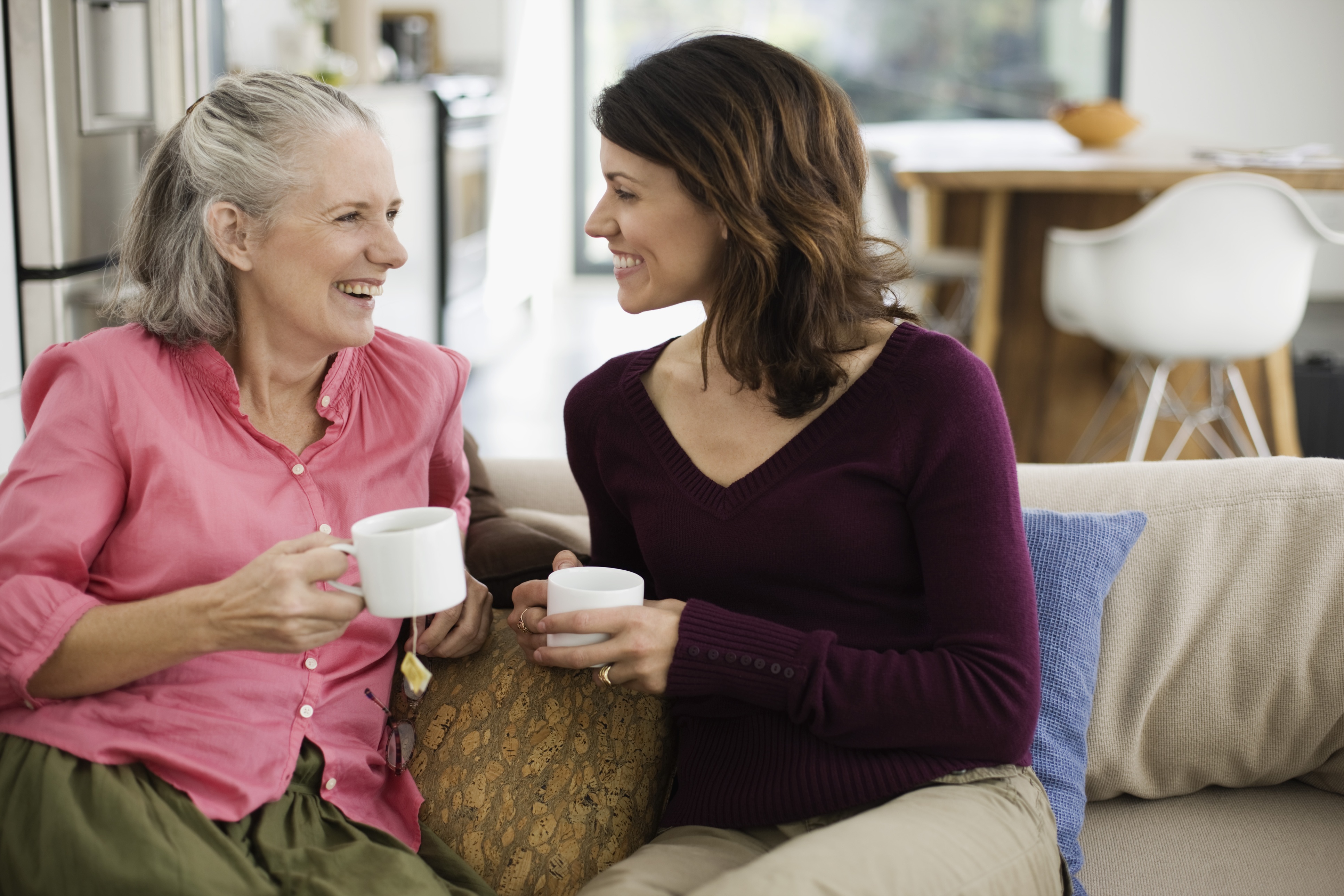 Woman drinking tea with her mother