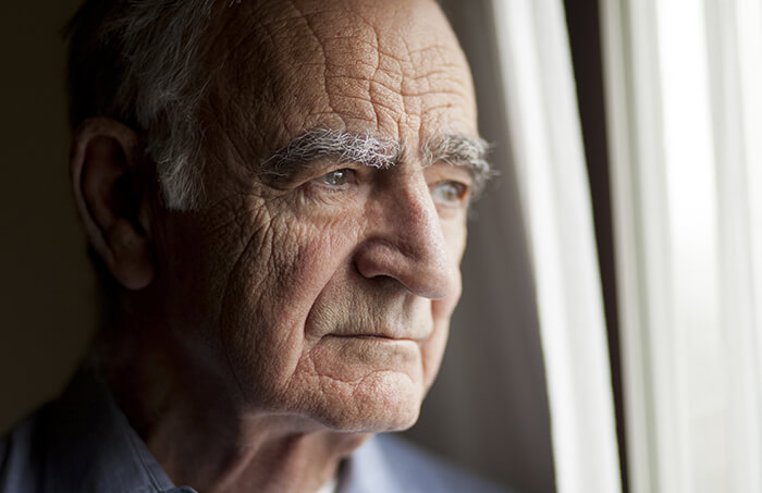 Man looking out a window