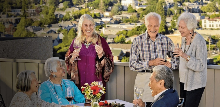 Group of residents having a cocktail party on the roof