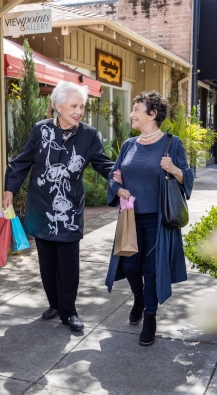 Two women walking after shopping