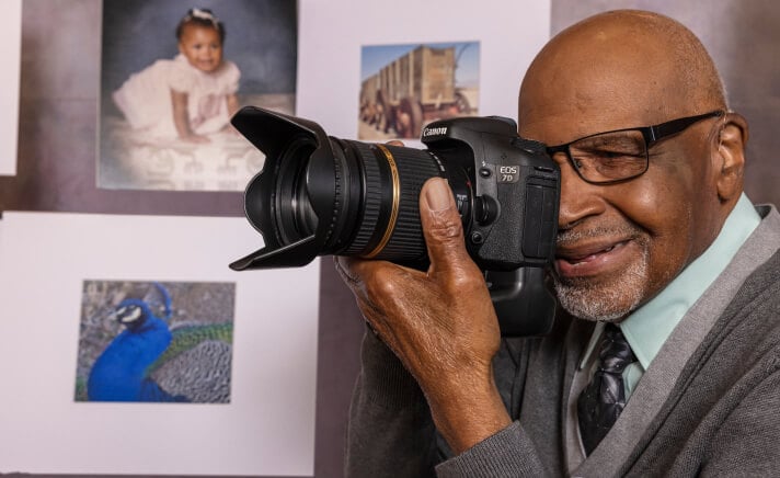 Senior man using a professional camera