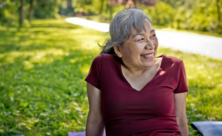 Senior woman sitting outside