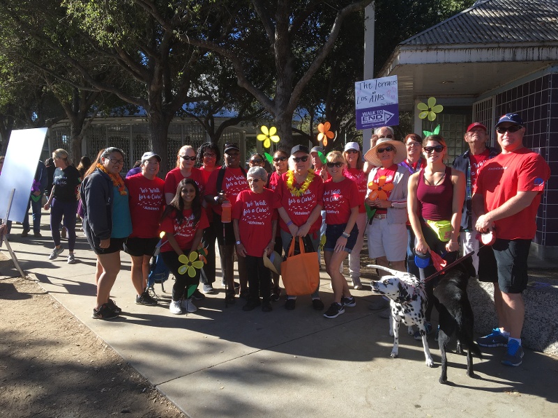 Residents on the Alzheimer's walk team pose together in their red t-shirts.