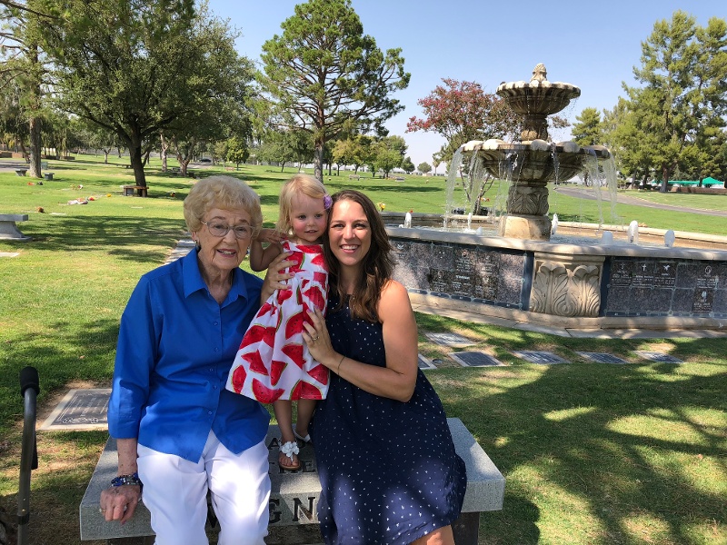 Three generations of women in a park