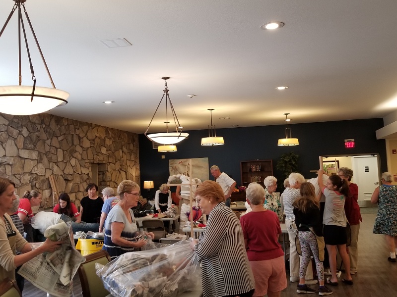 Residents picking out materials for their scarecrows.